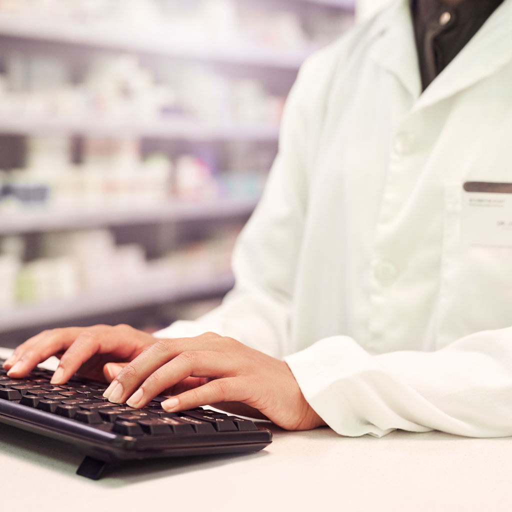 Pharmacist using a keyboard