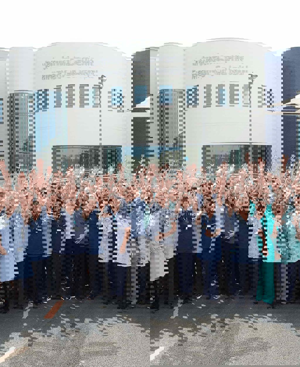 Nurses in front of Northumbria Healthcare NHS Foundation Trust